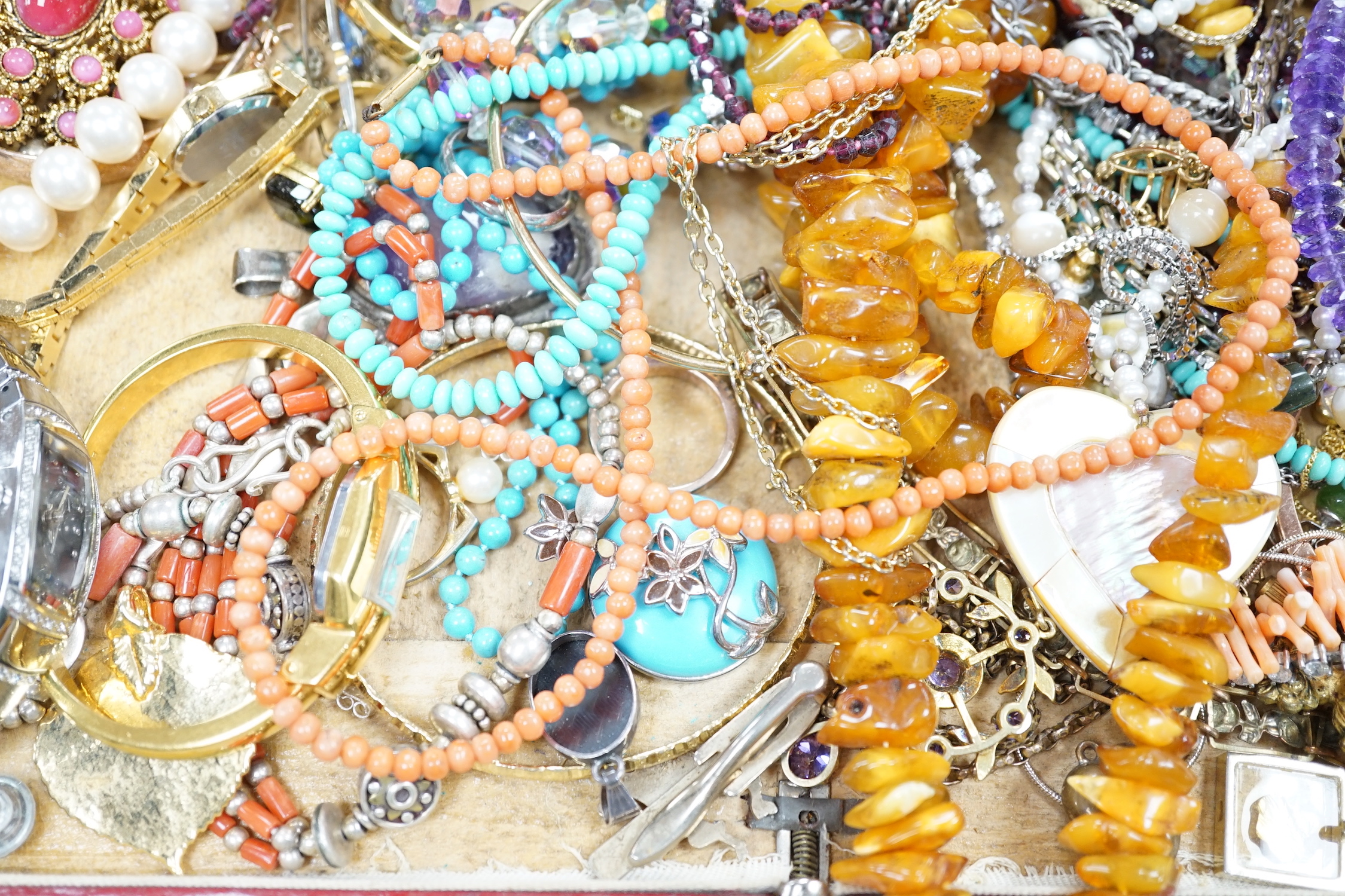 Assorted costume jewellery including amber necklace, coral necklace, cameo shell bracelet etc.